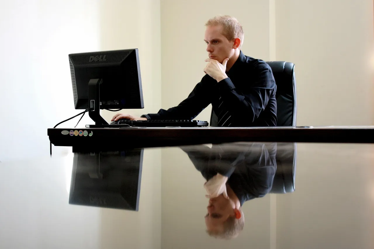 Business professional working at a desktop computer with Microsoft 365 apps